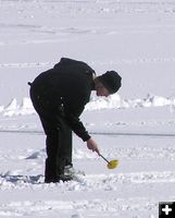 Scooping out a hole. Photo by Pinedale Online.