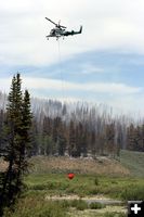 Helicopter bucket dip. Photo by Dawn Ballou, Pinedale Online.