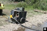 Pump in stream. Photo by Dawn Ballou, Pinedale Online.