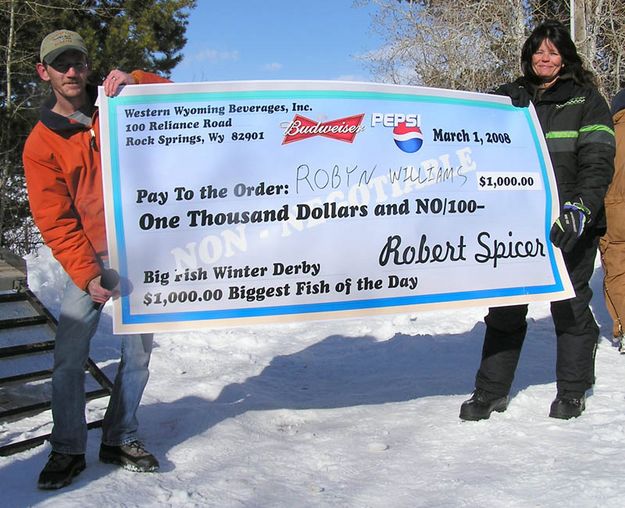 Robyn Williams $1000 check. Photo by Bill Boender.