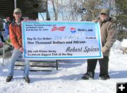 Joe Zuback $1000 check. Photo by Bill Boender.