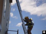 Climbing the ladder. Photo by Sublette County Fire Board.