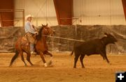 Doc Foster catches the calf. Photo by Dawn Ballou, Pinedale Online.