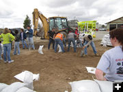 Filling sandbags. Photo by Bill Winney.