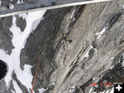 Dangling from the helicopter. Photo by Tony Chambers, Tip Top Search and Rescue.