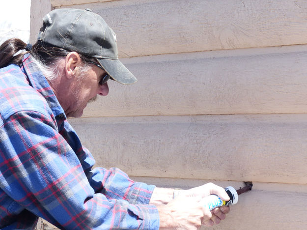 Caulking. Photo by Dawn Ballou, Pinedale Online.