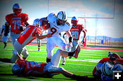 Caleb Evades Tackle. Photo by Terry Allen.