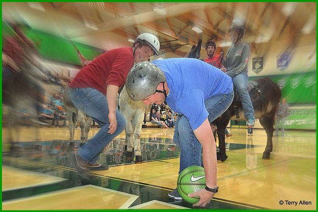 Rolling it Up His Leg. Photo by Terry Allen.