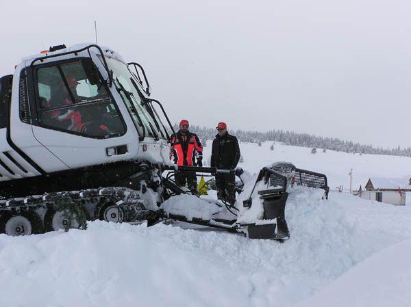 Cutting down the bump. Photo by Dawn Ballou, Pinedale Online.