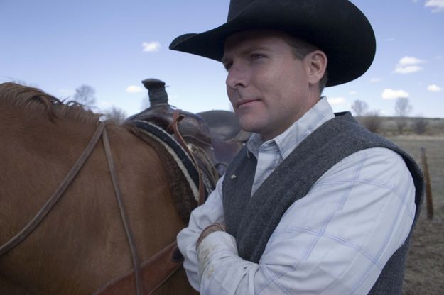 Roper Joe Gillis waits to mount his steed so that he can throw his rope around. Photo by Tara Bolgiano.