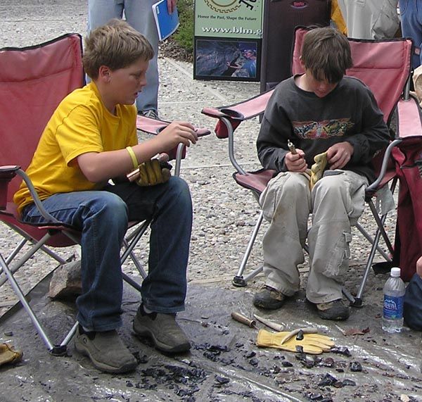 Learning to flint knap. Photo by Dawn Ballou, Pinedale Online.