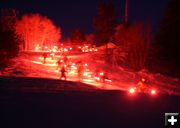 Night Skiing by torchlight. Photo by Fred Pflughoft.