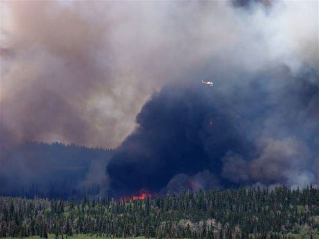 Helicopter on fire. Photo by Allene Dana.