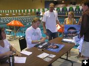 Signing up. Photo by Bob Rule, KPIN 101.1 FM Pinedale Radio.