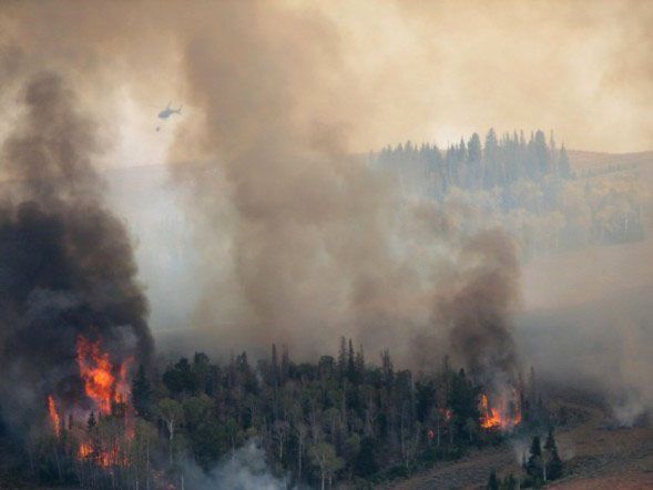 Helicopter on fire. Photo by Kenna Tanner.