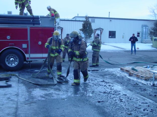 Dragging hose. Photo by Sublette County Fire Board.