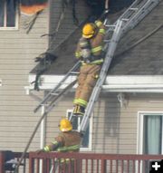 On the ladder. Photo by Clint Gilchrist, Pinedale Online.