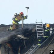 Chopping into the roof. Photo by Clint Gilchrist, Pinedale Online.