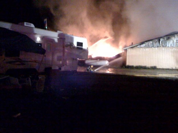 Wetting propane tank. Photo by Greg Remark.