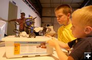 Admiring the robots. Photo by Dawn Ballou, Pinedale Online.