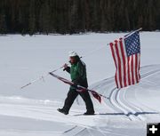 Courtney walks the flag. Photo by Mindi Crabb.