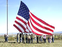 Raising Old Glory. Photo by Mari Muzzi, Sublette Examiner.