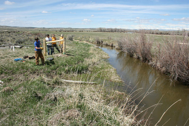 Fence over ditch. Photo by Dawn Ballou, Pinedale Online.