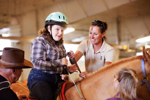 Hold the reins. Photo by Tara Bolgiano, Blushing Crow Photography.