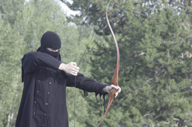 A soldier draws his bow. Photo by Tim Ruland, Pinedale Fine Arts Council.