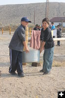 Takes two to carry it. Photo by Dawn Ballou, Pinedale Online.