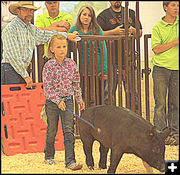 A Girl and Her Pig. Photo by Terry Allen.