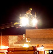 Inspecting roof. Photo by Dawn Ballou, Pinedale Online.