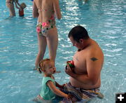 Dad and Daughter Count Eggs. Photo by Terry Allen.