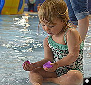 Isla Opens an Egg. Photo by Terry Allen.