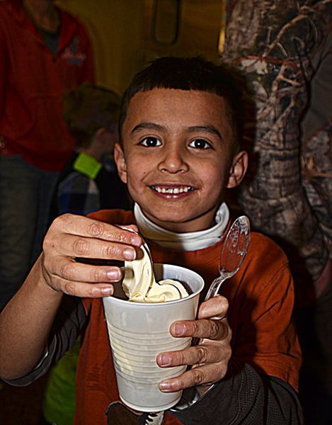 Yeriel Gets an Ice Cream Cup. Photo by Terry Allen.