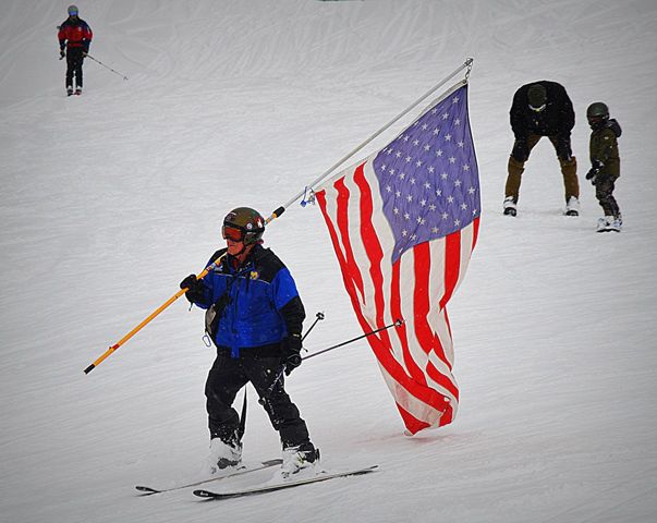 Courtney Takes the Flag Down. Photo by Terry Allen.