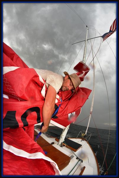 Jason Securing a Sail. Photo by Terry Allen.