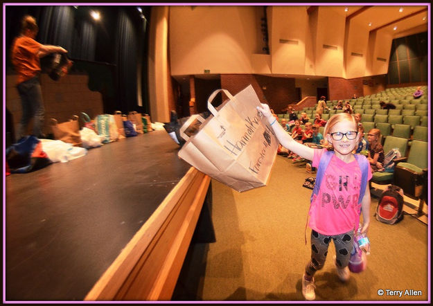 Hannah Grabs Her Costume Bag. Photo by Terry Allen.